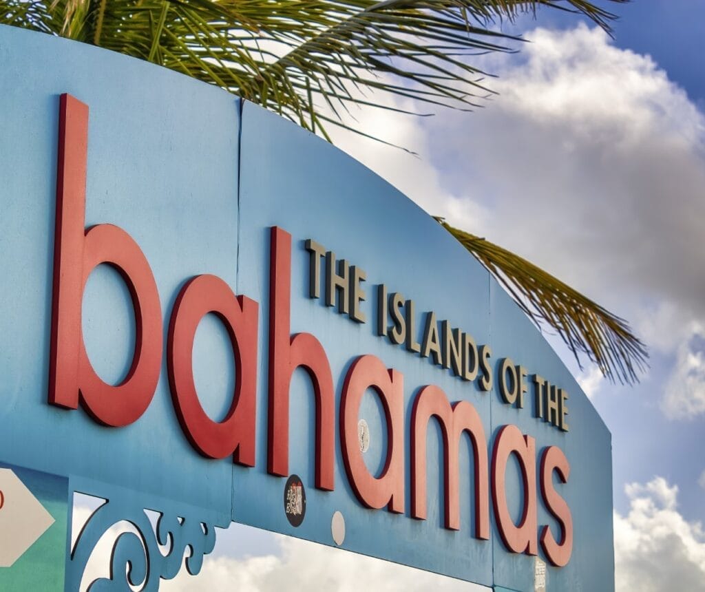 Colorful island entrance sign in Nassau, Bahamas, on a sunny day, enhancing the Bahamas cocktail experience.