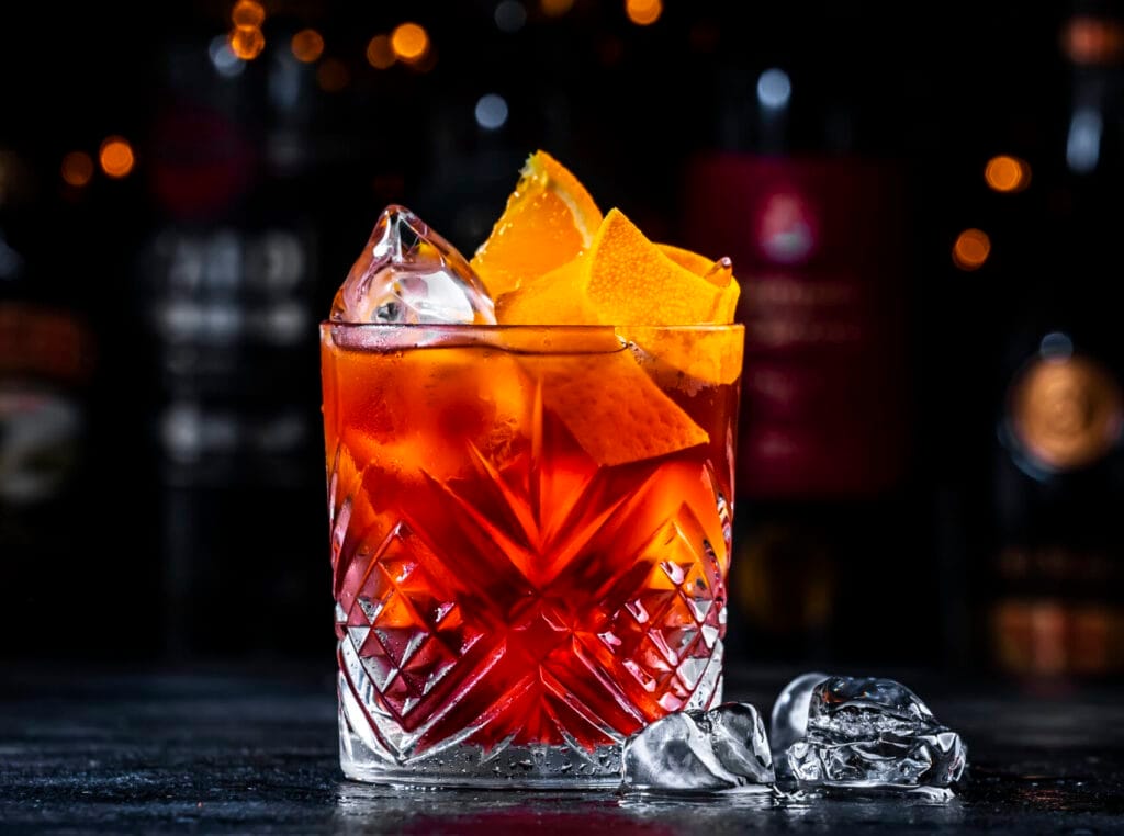 signature cocktails and craft beers Exuma - A vibrant coffee negroni cocktail featuring dry gin, vermouth, and orange, served